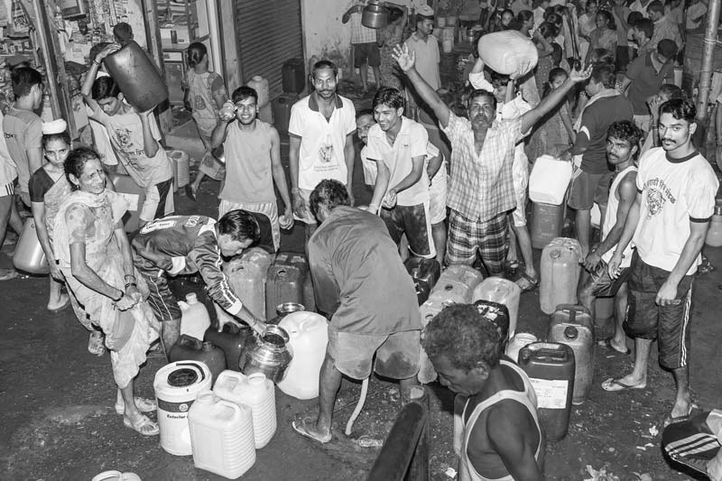 Human Right to Water in Mumbai - Rejoicing upon arrival of water at a group connection though late in the night